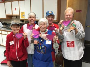 Fluvanna Meals on Wheels Kitchen Volunteer with Valentines Cards made by school children